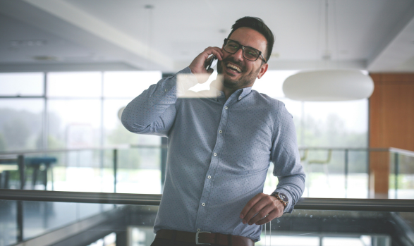 Happy man on phone with Tax Strategist