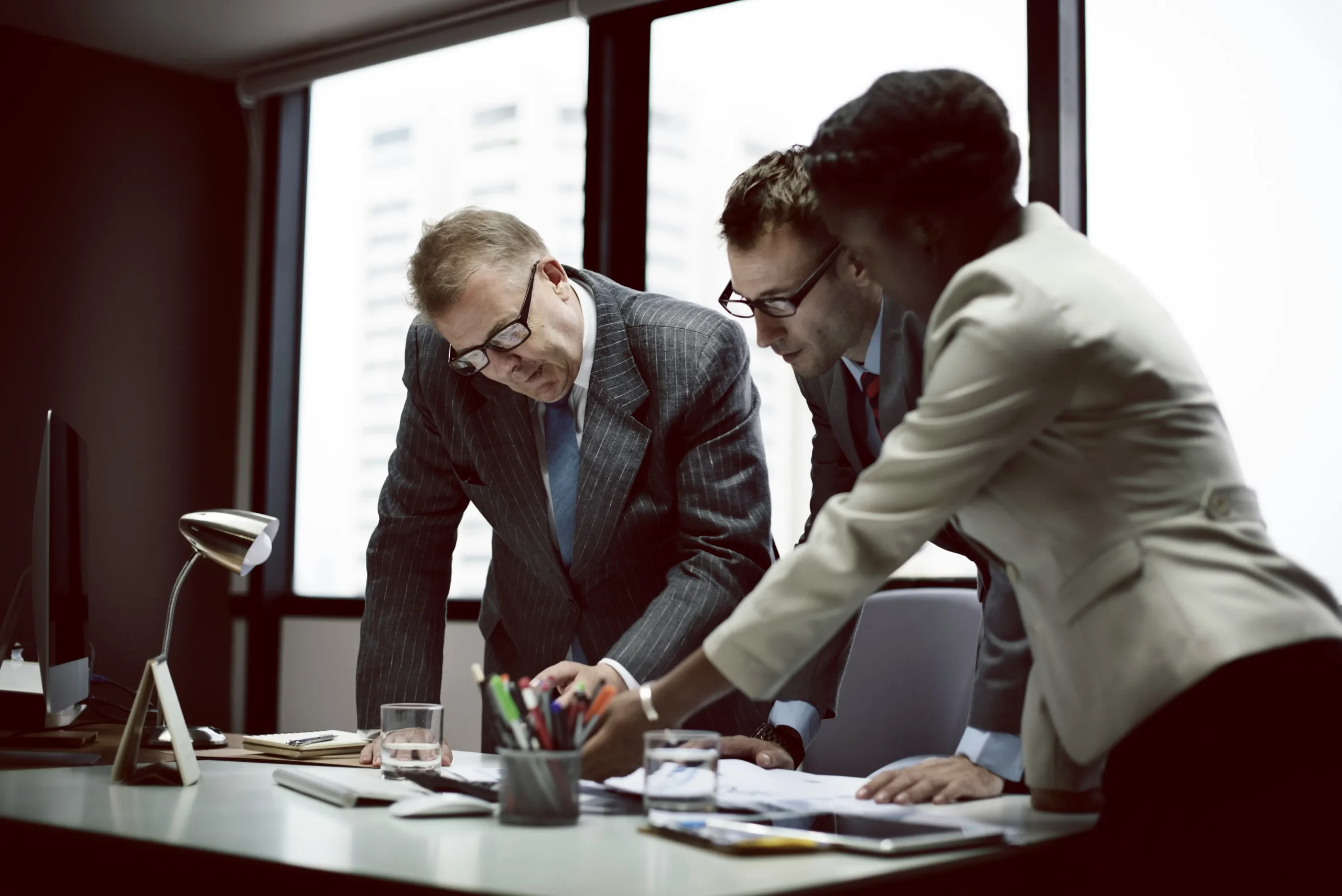 Utah Business Formation attorney Three business professionals collaborating
