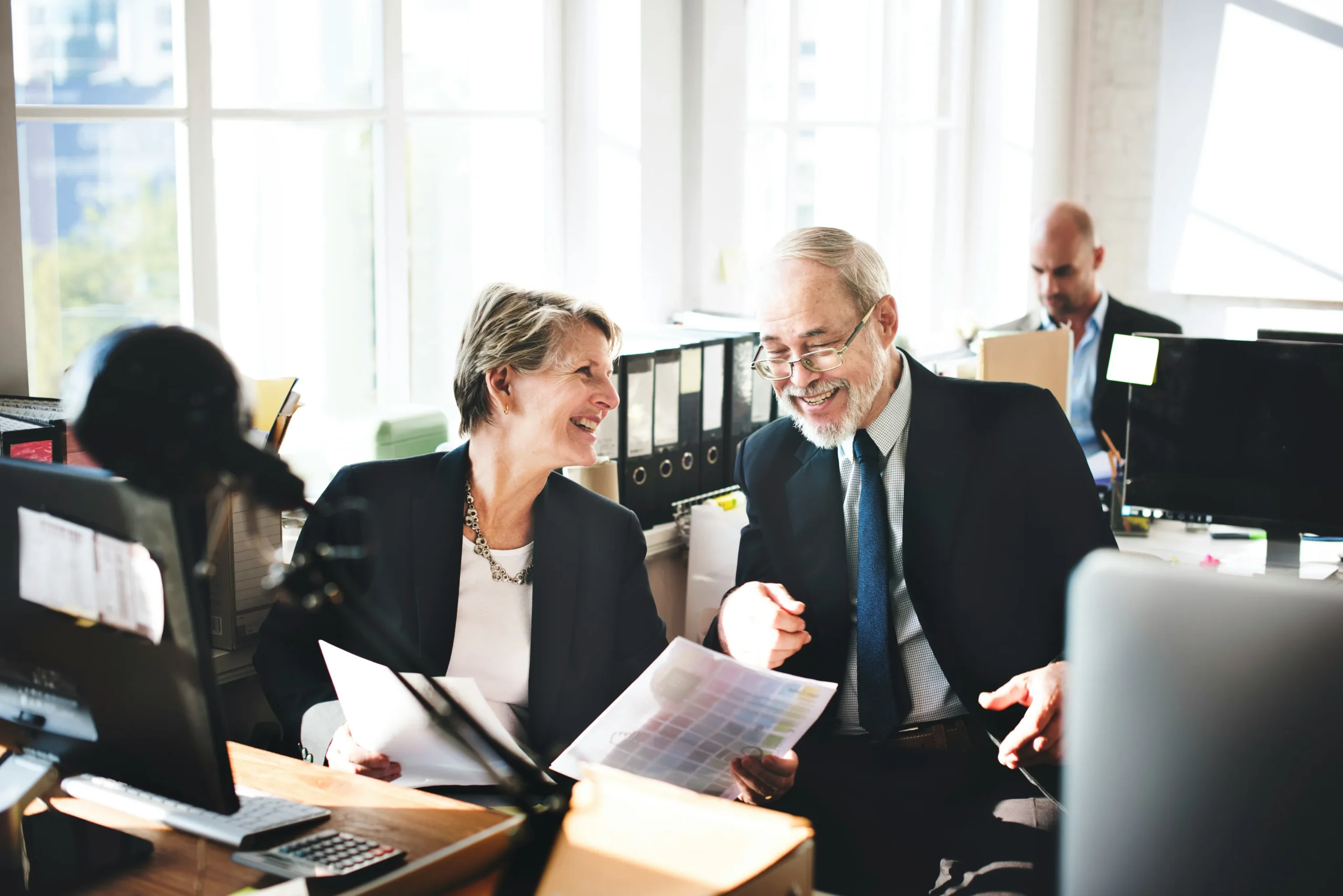 Utah Business Formation attorney two office colleague smiling
