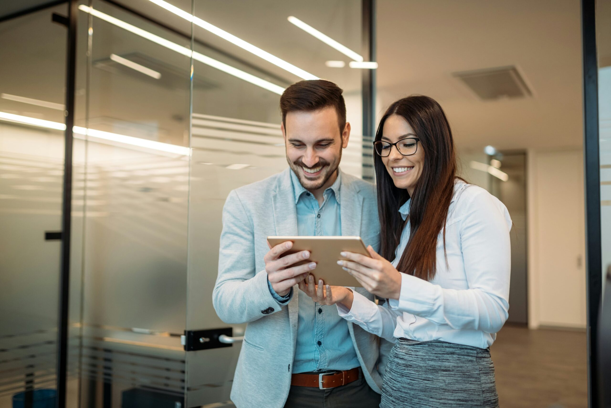 general counsel for small business Man and woman watching tablet