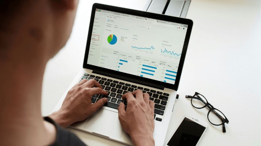 tax strategist reviewing estate tax savings projections on laptop